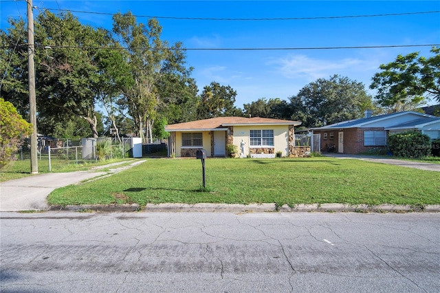 ranch-style house with a front lawn