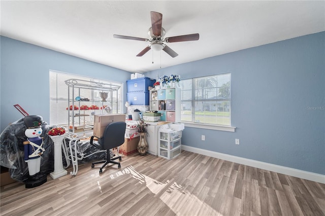 office area with ceiling fan and light hardwood / wood-style flooring