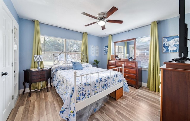 bedroom featuring ceiling fan and hardwood / wood-style floors