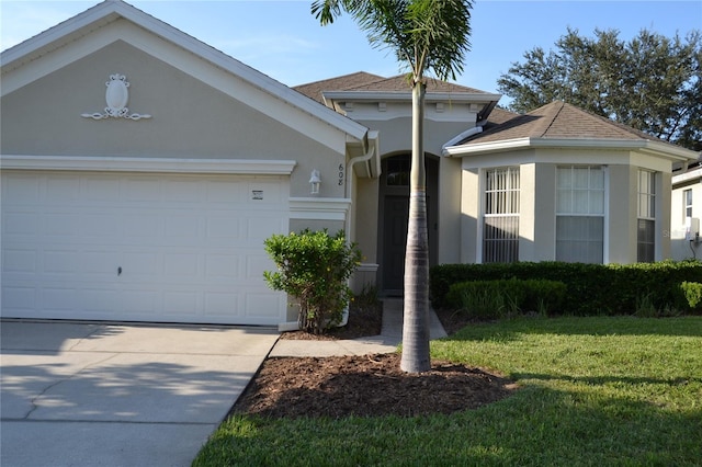 view of front facade with a garage and a front yard