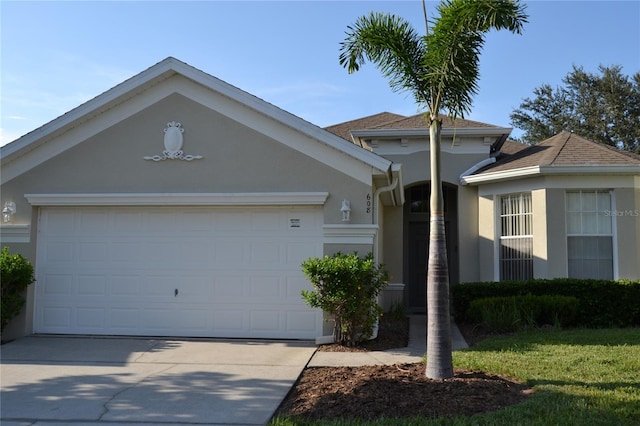 single story home with a garage