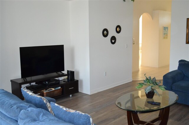 living room with dark hardwood / wood-style flooring