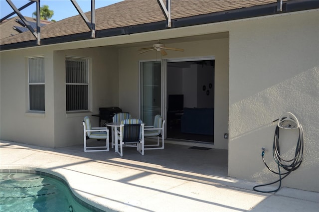 exterior space with ceiling fan