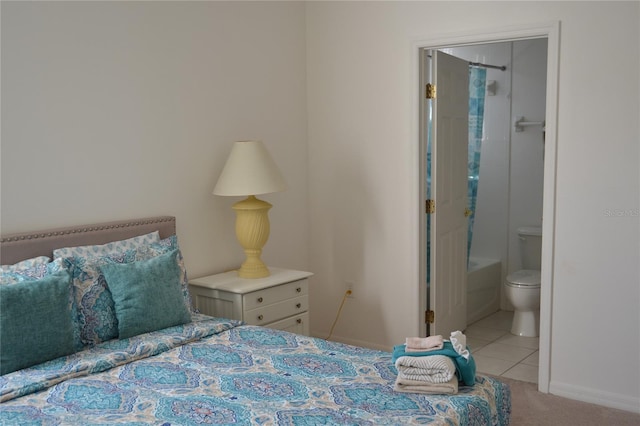 tiled bedroom featuring connected bathroom