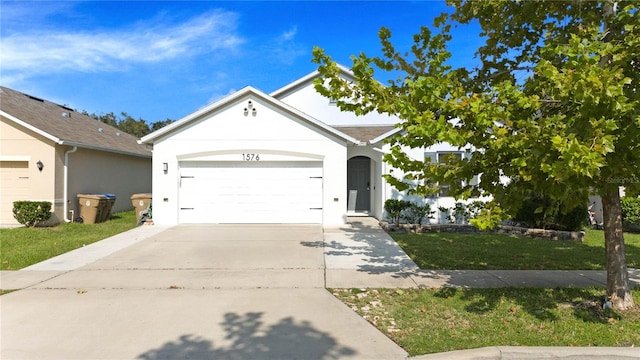 single story home with a front lawn and a garage