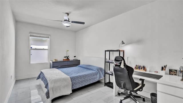 bedroom featuring a textured ceiling and ceiling fan