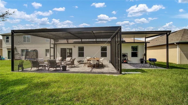 rear view of house with a yard and a patio