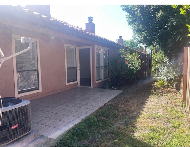 view of yard featuring a patio area and central AC