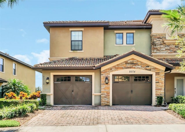 mediterranean / spanish-style house featuring a garage