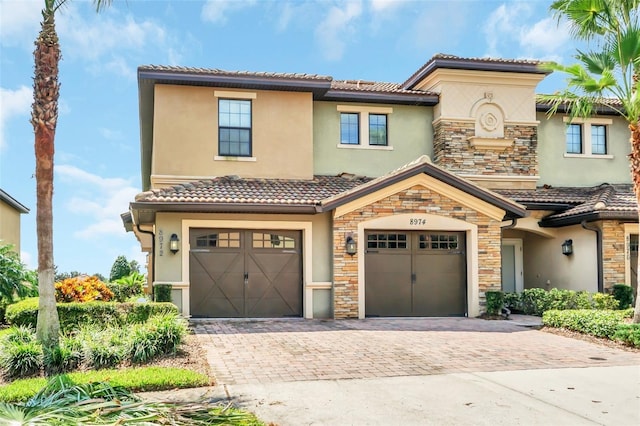 mediterranean / spanish-style home featuring a garage