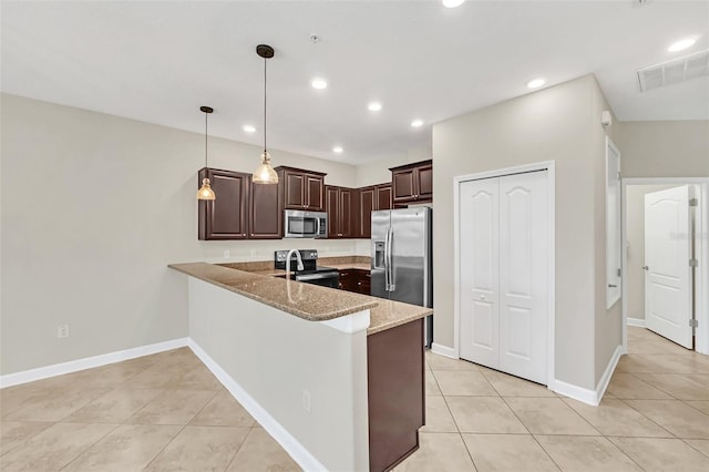 kitchen featuring pendant lighting, kitchen peninsula, stainless steel appliances, light tile patterned floors, and light stone countertops