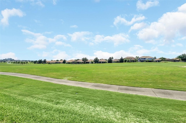 view of home's community with a lawn