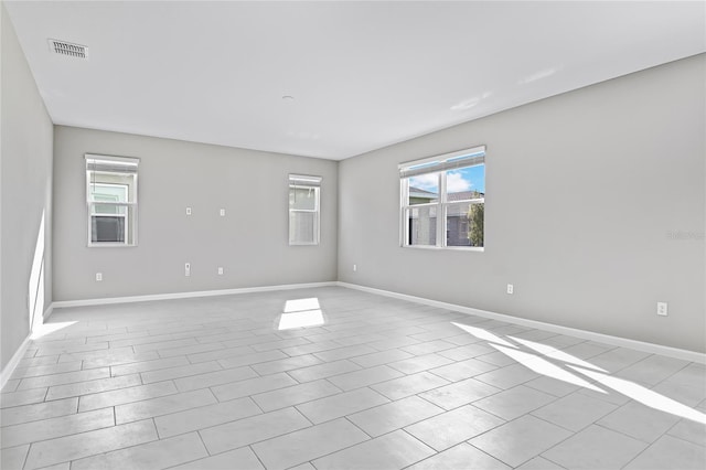 empty room with light tile patterned floors