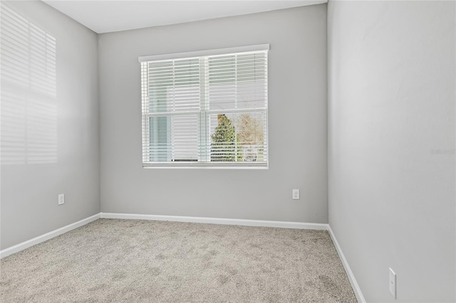 unfurnished room featuring carpet floors