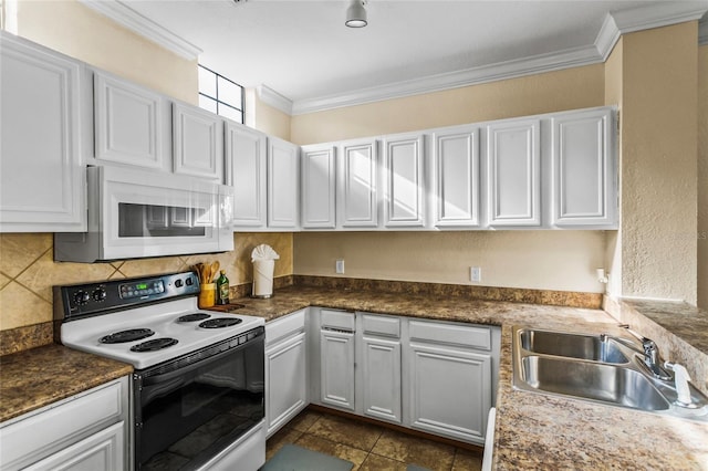 kitchen featuring white appliances, white cabinets, sink, decorative backsplash, and ornamental molding