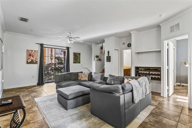 living room with ceiling fan, built in features, and ornamental molding