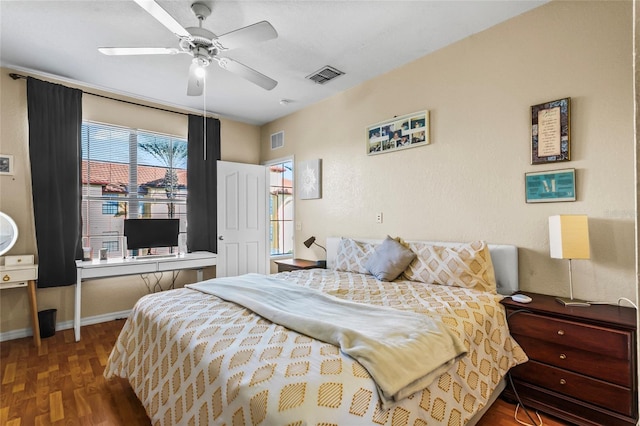 bedroom featuring ceiling fan and dark hardwood / wood-style floors