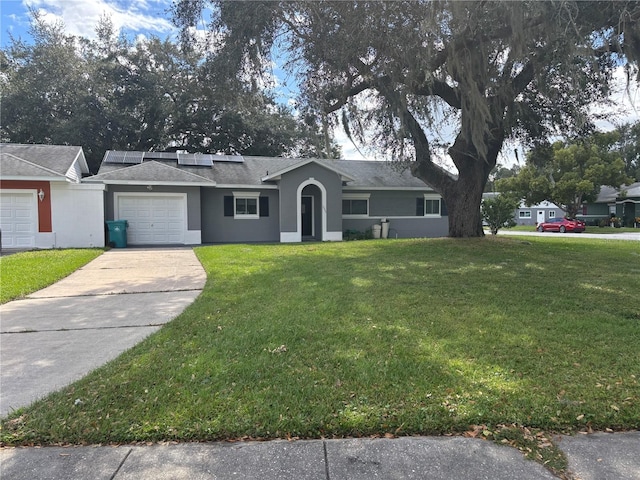 single story home featuring a garage and a front lawn