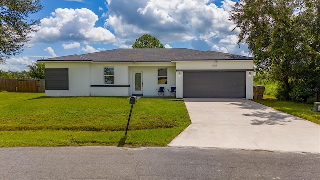 single story home with a front lawn and a garage