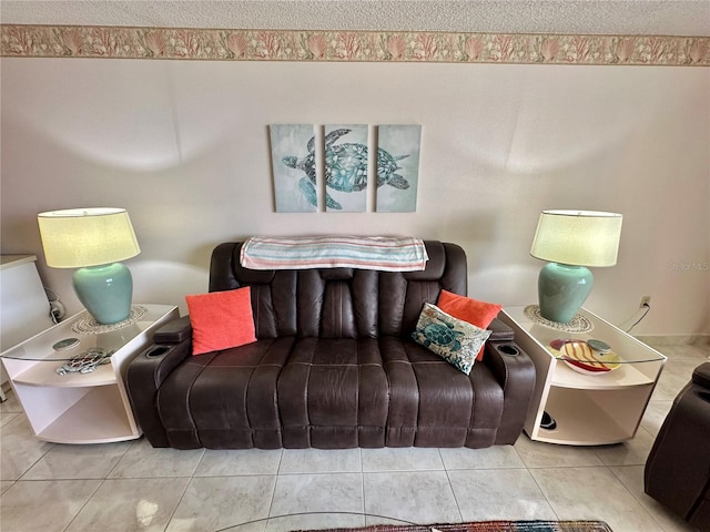 tiled living room featuring a textured ceiling