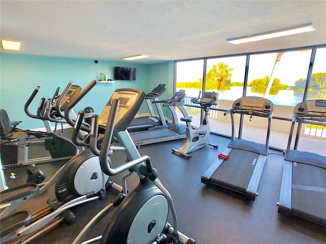 exercise room with a textured ceiling