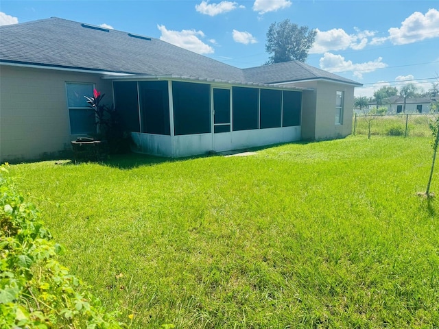 view of yard featuring a sunroom