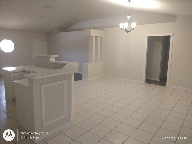 kitchen with an inviting chandelier, decorative light fixtures, and light tile patterned flooring