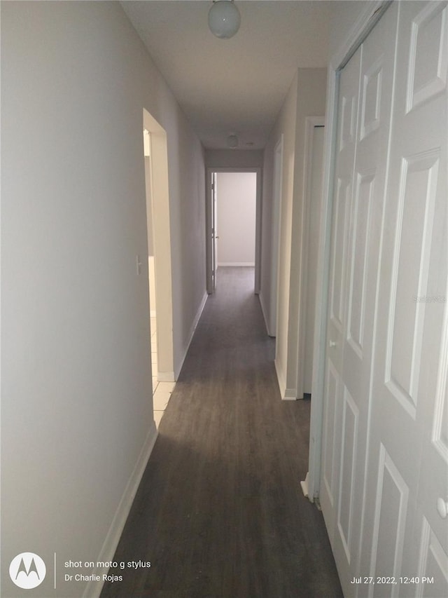 corridor featuring dark hardwood / wood-style floors