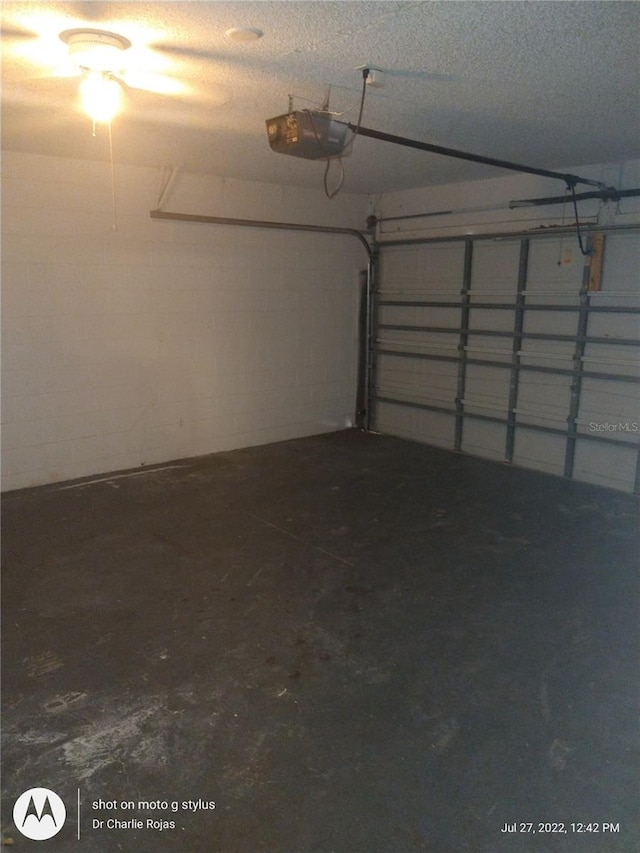 garage featuring a garage door opener