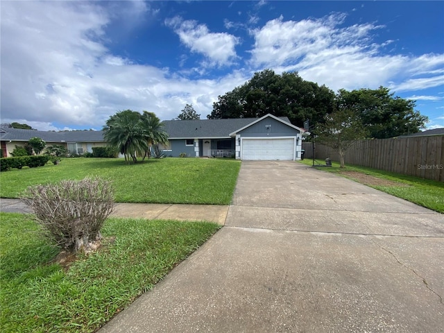 single story home with fence, a front yard, driveway, and a garage