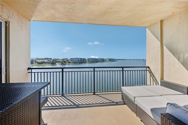 balcony featuring a water view