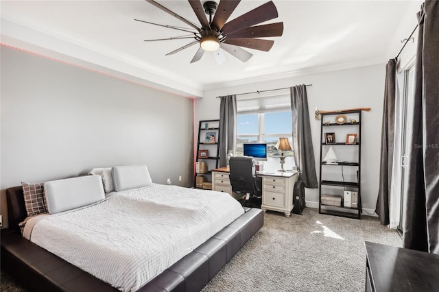 carpeted bedroom featuring ceiling fan and ornamental molding