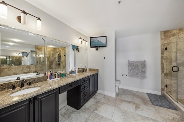 bathroom featuring an enclosed shower, vanity, and toilet