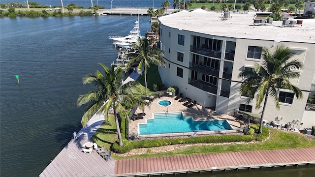 exterior space featuring a water view and a patio area