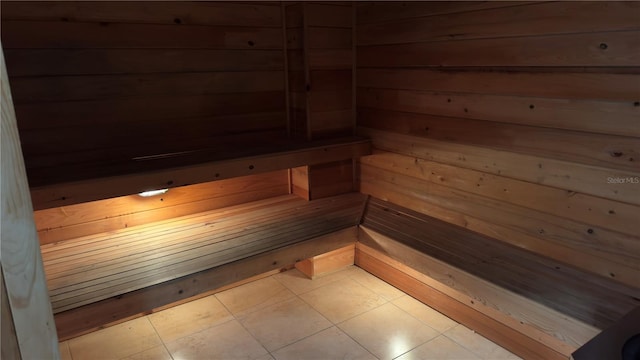 view of sauna with wooden walls