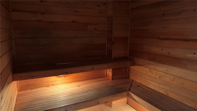 view of sauna featuring wood walls