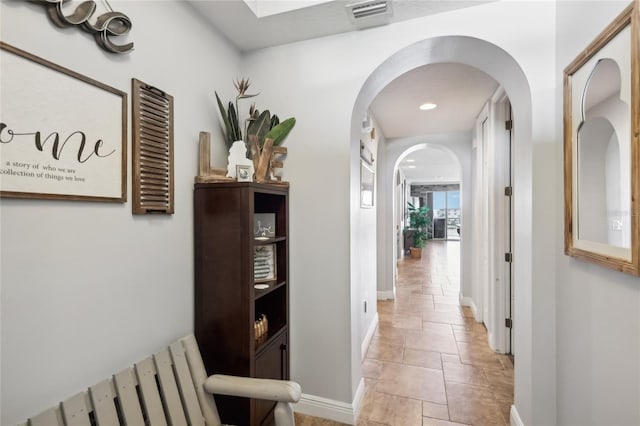 hallway with light tile patterned floors