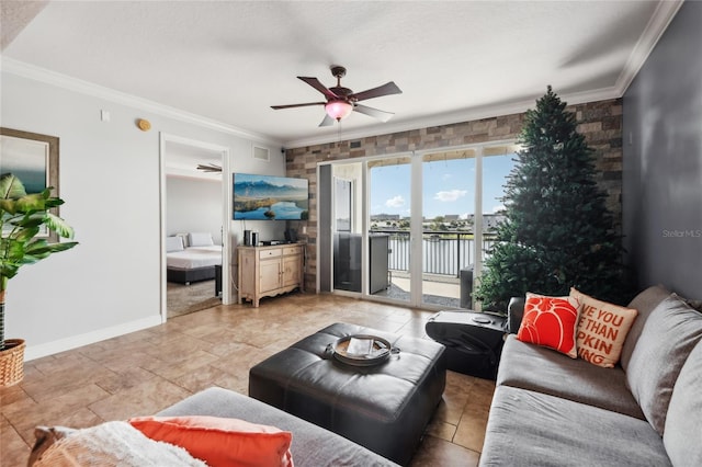 living room featuring ornamental molding and ceiling fan