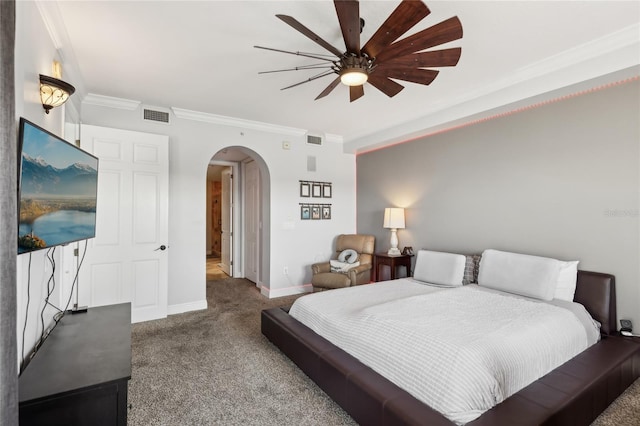 bedroom with carpet floors, crown molding, and ceiling fan