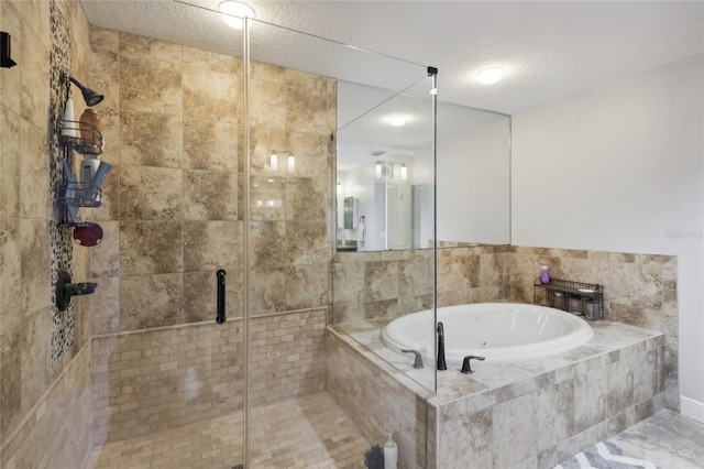 bathroom featuring a textured ceiling and plus walk in shower