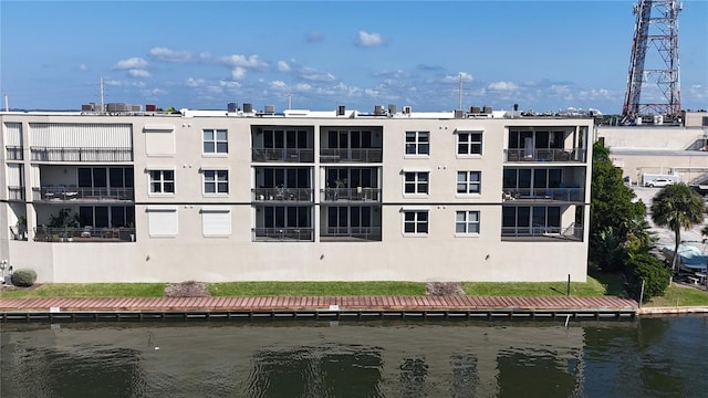 view of building exterior with a water view