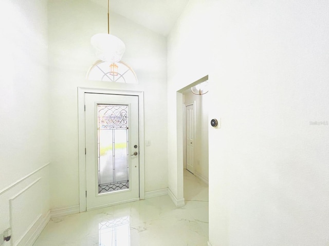 foyer featuring a high ceiling