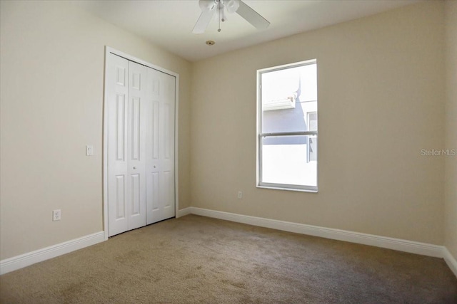 3757 Eagle Isle Cir, Kissimmee, FL 34746 - unfurnished bedroom featuring baseboards, carpet floors, a closet, and a ceiling fan