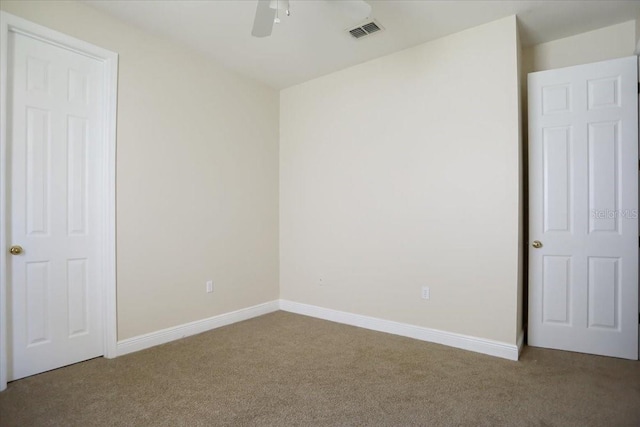 unfurnished bedroom featuring ceiling fan and carpet flooring