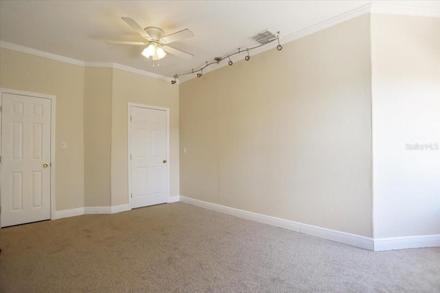 3757 Eagle Isle Cir, Kissimmee, FL 34746 - empty room with carpet flooring, visible vents, baseboards, ornamental molding, and ceiling fan