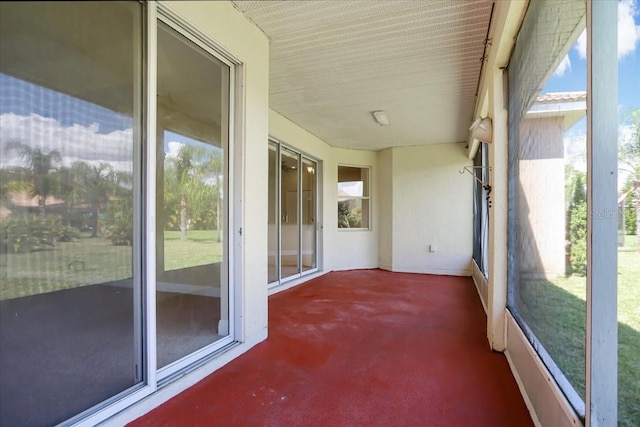 unfurnished sunroom featuring a healthy amount of sunlight