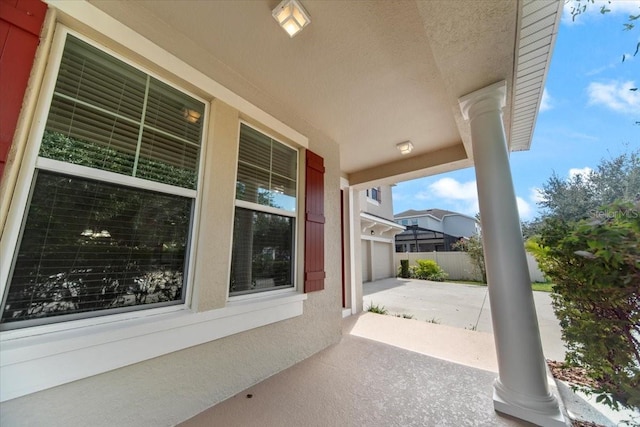 view of patio / terrace featuring a garage