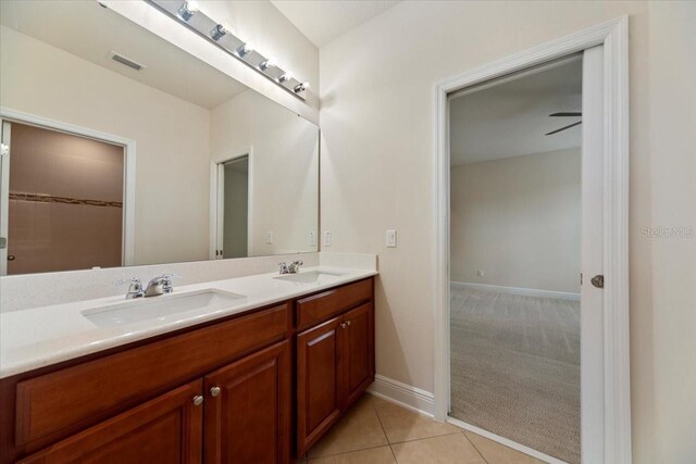 bathroom featuring vanity, ceiling fan, and tile patterned floors