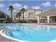 view of swimming pool with a hot tub