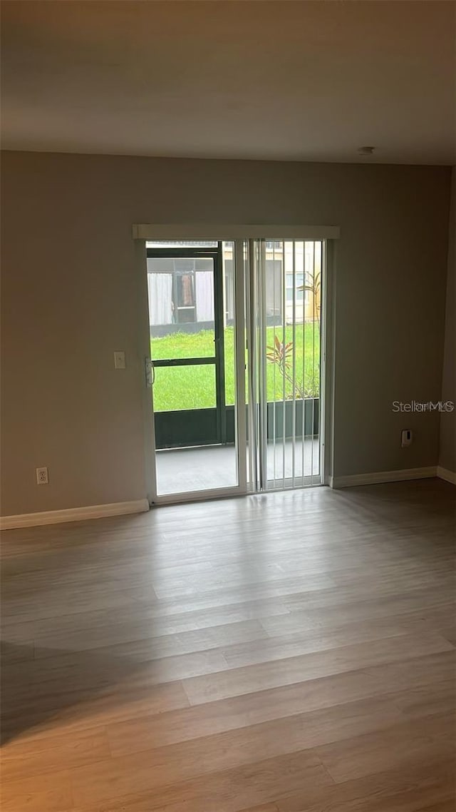 spare room with light hardwood / wood-style floors